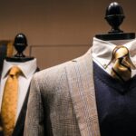 elegant male outfits on dummies in modern boutique